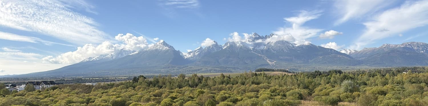 The High Tatras range seen from the apartment balcony, from Gerlachovský štít on the left to the Belianske Tatry on the right.